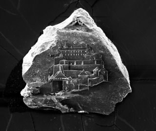 Illustration for article titled These Sand Castles Are Actually Castles Carved on Grains of Sand